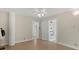 Cozy bedroom featuring neutral walls, ceiling fan, and multiple doorways at 509 E Ashley Ave, Folly Beach, SC 29439