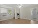 Inviting bedroom with neutral walls, ceiling fan, and bright windows at 509 E Ashley Ave, Folly Beach, SC 29439