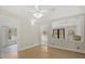 Neutral bedroom filled with natural light and connecting to sunroom at 509 E Ashley Ave, Folly Beach, SC 29439