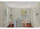 Charming dining area bathed in natural light with wood floors at 509 E Ashley Ave, Folly Beach, SC 29439