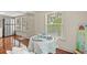 Cozy dining area with natural light, table setting and hardwood flooring at 509 E Ashley Ave, Folly Beach, SC 29439
