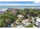 Beautiful aerial view of a charming beach home surrounded by trees and close to the ocean at 509 E Ashley Ave, Folly Beach, SC 29439