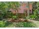 Lovely home exterior with lush landscaping and a charming fence at 509 E Ashley Ave, Folly Beach, SC 29439