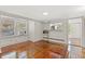 Bright living room featuring hardwood floors, multiple windows, and built-in features at 509 E Ashley Ave, Folly Beach, SC 29439