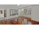 Living room with hardwood floors and view into the screened-in porch at 509 E Ashley Ave, Folly Beach, SC 29439