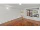Light-filled living room with hardwood floors at 509 E Ashley Ave, Folly Beach, SC 29439