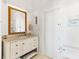 Elegant bathroom featuring a marble countertop vanity, toilet, and classic decor at 509 W Ashley Ave, Folly Beach, SC 29439