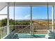 Relaxing porch swing with ocean view, perfect for enjoying the coastal breeze at 509 W Ashley Ave, Folly Beach, SC 29439