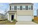 Charming two-story home featuring black shutters, a built-in garage, and manicured landscaping at 549 Pender Woods Dr, Summerville, SC 29486