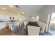 Open-concept kitchen with granite countertops, stainless steel appliances, and eat-in island at 550 Pender Woods Dr, Summerville, SC 29486