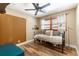 Cozy bedroom featuring a daybed, wood floors and a ceiling fan at 5904 Hagood Ave, Hanahan, SC 29410