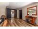 Bonus room with wood floors, a sliding barn door to the laundry room, and natural light at 5904 Hagood Ave, Hanahan, SC 29410