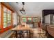 Bright dining area with rustic wooden table, bench, and plenty of natural light at 5904 Hagood Ave, Hanahan, SC 29410
