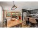 Inviting dining room featuring a wooden table, pendant lighting, and bar seating at 5904 Hagood Ave, Hanahan, SC 29410