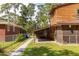 Shows wood panel exterior with covered carport and fenced yard, offering both convenience and privacy at 5904 Hagood Ave, Hanahan, SC 29410