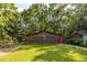 The property has a detached two car garage with a red door at 5904 Hagood Ave, Hanahan, SC 29410