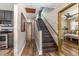 Hallway with wood floors and staircase leading to an upper level at 5904 Hagood Ave, Hanahan, SC 29410