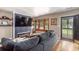 Cozy living room with modern fireplace, large TV, and comfortable gray sofa at 5904 Hagood Ave, Hanahan, SC 29410