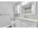 Well-lit bathroom features a marble vanity, gold fixtures, and a built-in cabinet at 598 Maple Branch Rd, Reevesville, SC 29471