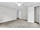 A cozy bedroom features neutral carpet, updated ceiling fan, and closet at 598 Maple Branch Rd, Reevesville, SC 29471