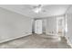 The bedroom features neutral carpet, ceiling fan, and an en suite at 598 Maple Branch Rd, Reevesville, SC 29471
