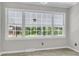 Bright dining area featuring a large window providing outdoor views at 598 Maple Branch Rd, Reevesville, SC 29471