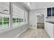 Sunlit dining area with a large window offering a view to the back yard at 598 Maple Branch Rd, Reevesville, SC 29471