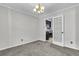 Elegant dining room provides access to the kitchen and features a stylish light fixture at 598 Maple Branch Rd, Reevesville, SC 29471
