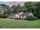 A well-maintained brick house features black shutters, a manicured lawn, and lush landscaping at 598 Maple Branch Rd, Reevesville, SC 29471