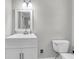 Clean half bath with a new vanity, sink, and fixtures at 598 Maple Branch Rd, Reevesville, SC 29471