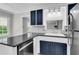Well-lit kitchen features stainless appliances, undermount sink and breakfast bar at 598 Maple Branch Rd, Reevesville, SC 29471