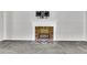 Cozy living room showcases a brick fireplace with white mantel and geometric tile hearth at 598 Maple Branch Rd, Reevesville, SC 29471
