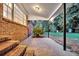 Spacious covered patio featuring brick stairs and lush greenery, ideal for outdoor relaxation at 598 Maple Branch Rd, Reevesville, SC 29471