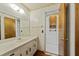 Bathroom with large countertop sink and shower, and view into attached room at 604 Longstreet St, Summerville, SC 29486