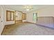 Bedroom with carpet and connected rooms, and windows to the backyard at 604 Longstreet St, Summerville, SC 29486