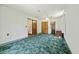 Carpeted bedroom with ceiling fan, multiple closets, and neutral wall paint at 604 Longstreet St, Summerville, SC 29486