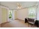 Bedroom with light pink walls, closet, and desk overlooking the backyard at 604 Longstreet St, Summerville, SC 29486