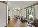 Bright dining room featuring hardwood floors, ceiling fan, and natural light from the windows at 604 Longstreet St, Summerville, SC 29486
