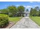 Charming single-story home with a well-manicured lawn, mature trees and long driveway at 604 Longstreet St, Summerville, SC 29486