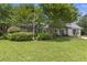 Charming single-story home with a well-manicured lawn and mature trees offering shade and curb appeal at 604 Longstreet St, Summerville, SC 29486