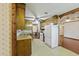 Functional kitchen with wood cabinets, white appliances, and laminate countertops at 604 Longstreet St, Summerville, SC 29486