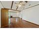 Living room with exposed wood beams, hardwood floors, and built-in wood cabinet at 604 Longstreet St, Summerville, SC 29486