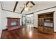 Cozy living room with a brick fireplace, vaulted ceilings, hardwood floors, and natural light at 604 Longstreet St, Summerville, SC 29486