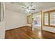 Sunlit living room with hardwood flooring, a ceiling fan, and ample space for furniture at 604 Longstreet St, Summerville, SC 29486