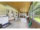 Enclosed sun room with wooden ceiling and several large windows for ample natural light and exterior views at 604 Longstreet St, Summerville, SC 29486