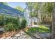 A grassy backyard with a wooden fence and lots of trees at 642 Bridlewood Ln, Mount Pleasant, SC 29464
