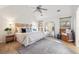 Serene bedroom with vaulted ceilings, wood-look floors, ample natural light, and comfortable decor at 642 Bridlewood Ln, Mount Pleasant, SC 29464