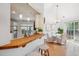 Bright dining area featuring hardwood floors, a modern chandelier, and sliding glass doors to the outdoor space at 642 Bridlewood Ln, Mount Pleasant, SC 29464