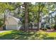 Home exterior with a two car garage, lush lawn and beautiful trees at 642 Bridlewood Ln, Mount Pleasant, SC 29464