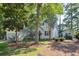 A well-maintained home with mature trees, lush lawn, and a neatly mulched garden at 642 Bridlewood Ln, Mount Pleasant, SC 29464
